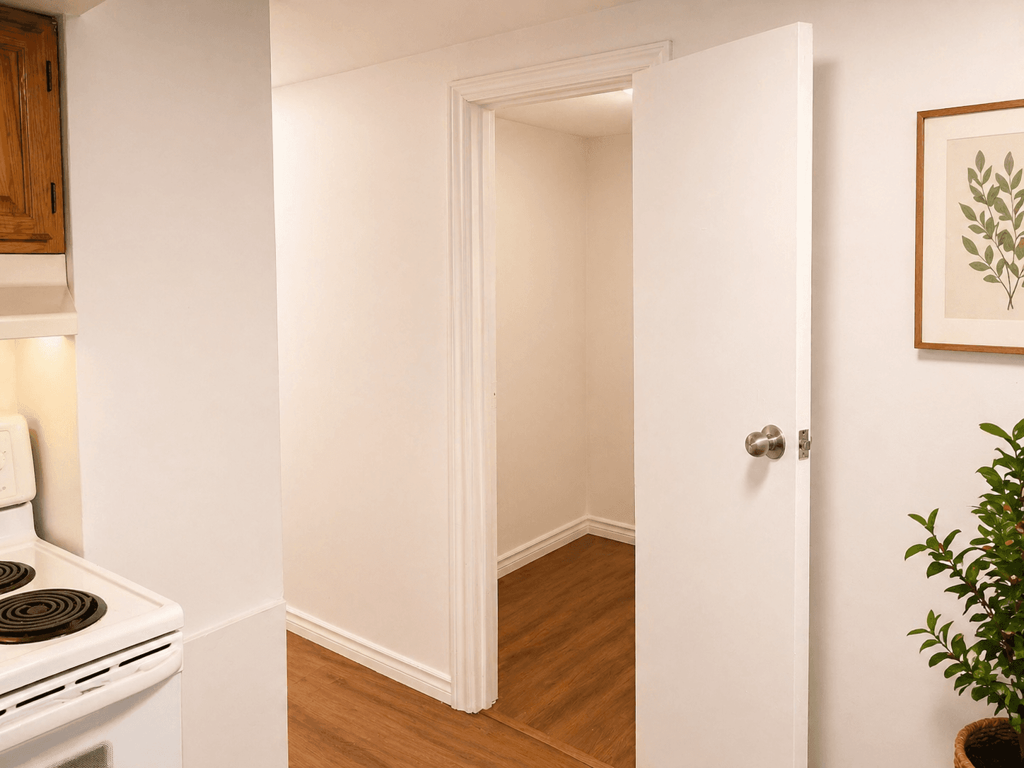 Kitchen Area with Entrance to Another Room at Modern 2-Bedroom Apartment in Hintonburg – Parking Included, a 2 bedroom rental in 5 Armstrong Street, Ottawa, ON, listed for $1,850 per month