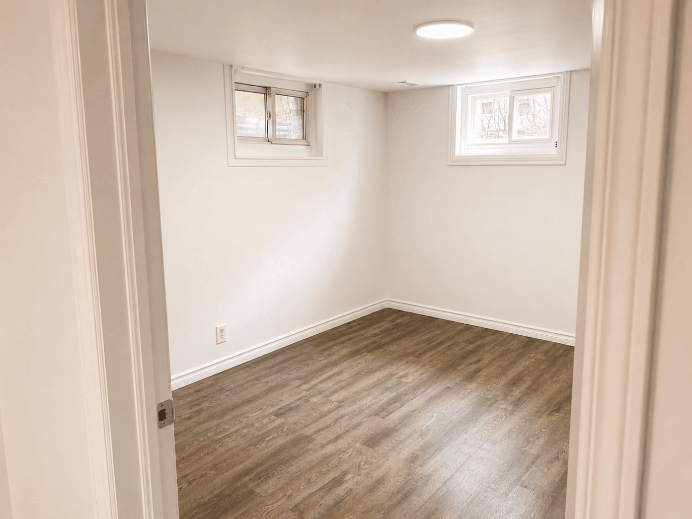 Small Bedroom with Windows at Modern 2-Bedroom Apartment in Hintonburg – Parking Included, a 2 bedroom rental in 5 Armstrong Street, Ottawa, ON, listed for $1,850 per month