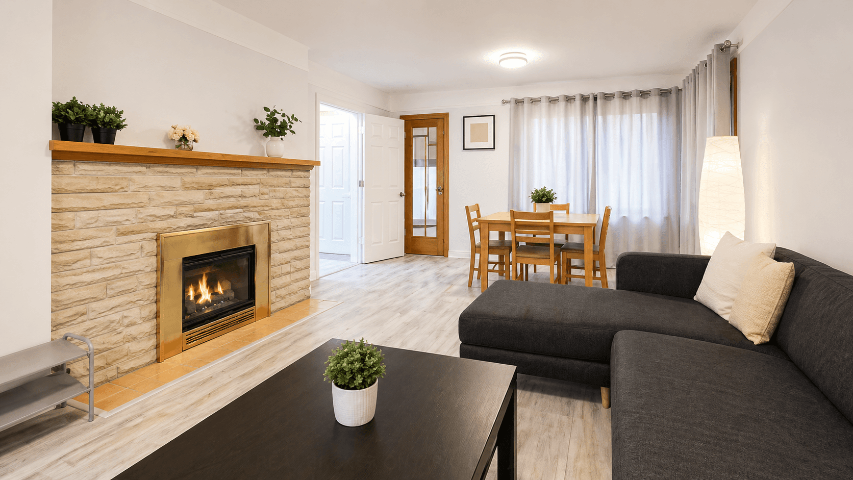 Cozy Living Room with Fireplace and Dining Area at Spacious 3-Bedroom Main Level in Waterloo – Prime Location, a 3 bedroom rental in 74 McDougall Road, Waterloo, ON, listed for $2,550 per month
