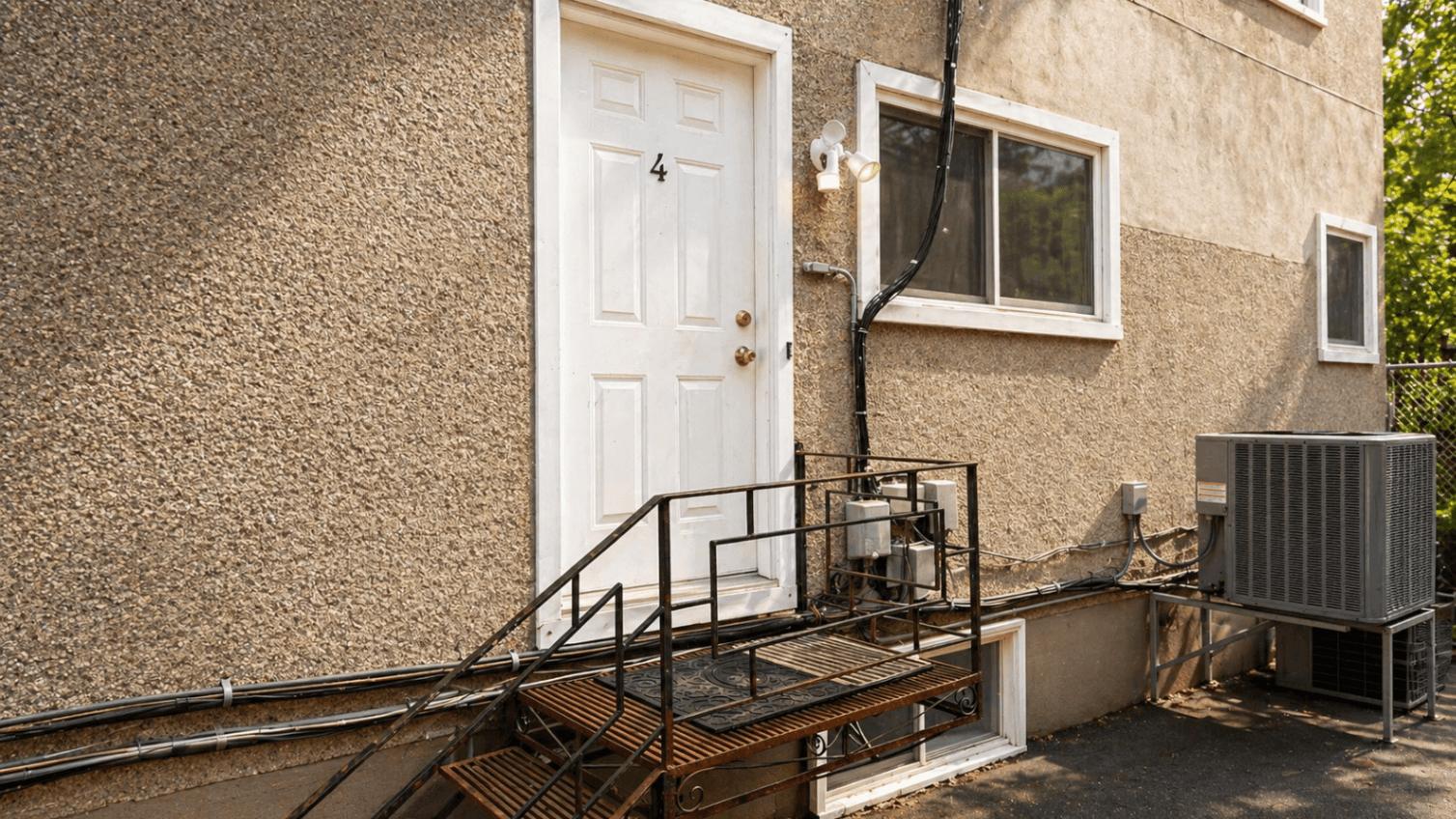 Back Entrance with Metal Staircase at Modern 1-Bedroom Condo in Hintonburg, Ottawa – Prime Location, a 1 bedroom rental in 4 Armstrong Street, Ottawa, ON, listed for $1,795 per month