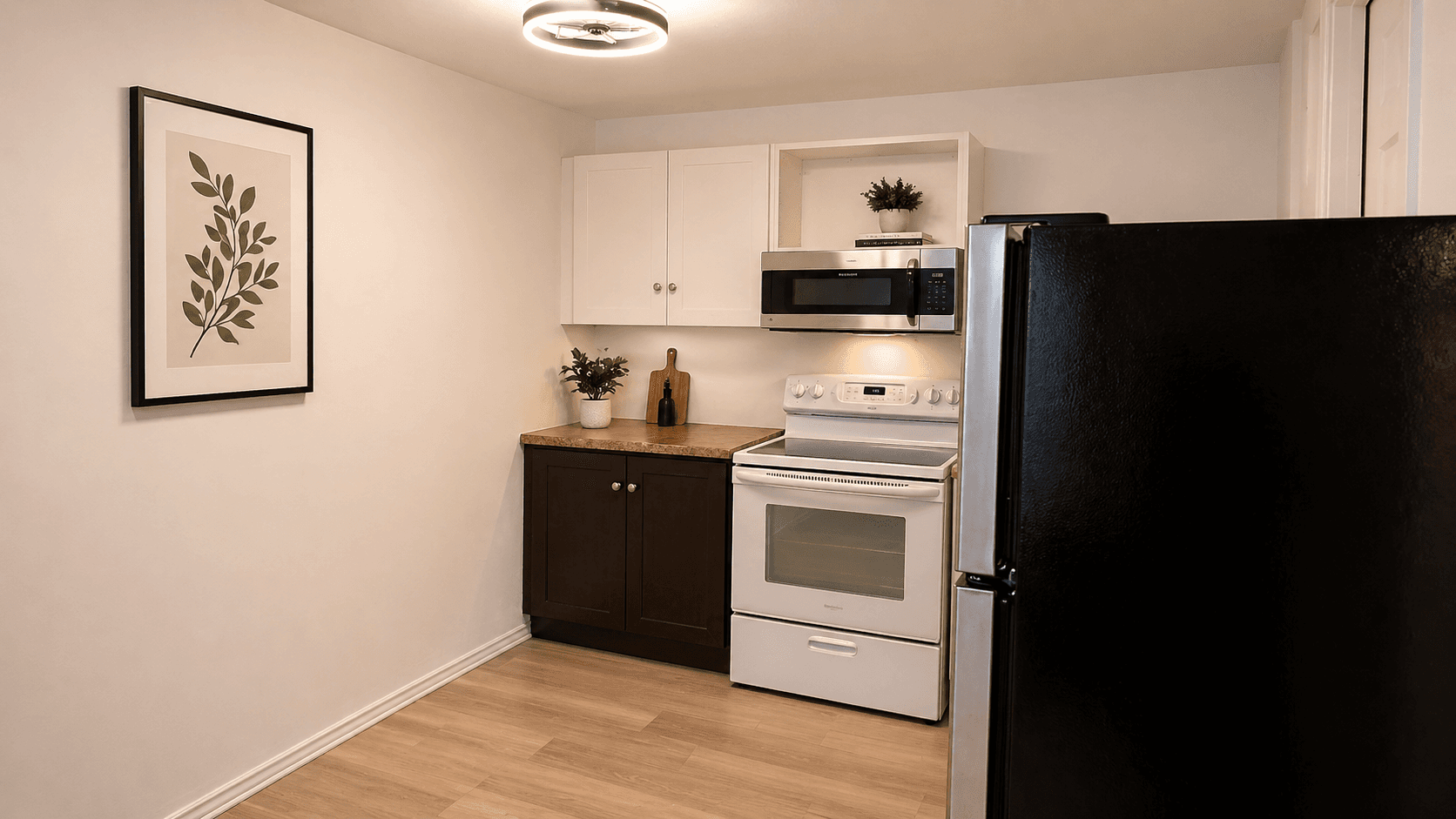 Modern Kitchen with Plants and Appliances at Modern 1-Bedroom Condo in Hintonburg, Ottawa – Prime Location, a 1 bedroom rental in 4 Armstrong Street, Ottawa, ON, listed for $1,795 per month