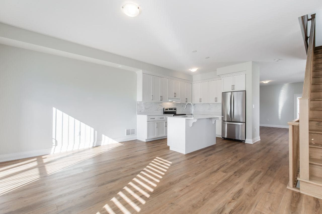 Modern Kitchen with Island and Stainless Appliances at 1 Bedroom Townhouse for $1,200, a 1 bedroom rental in 23 BayBerry Lane, Hamilton, ON, listed for $1,200 per month